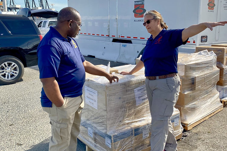 workers performing inventory on pallets