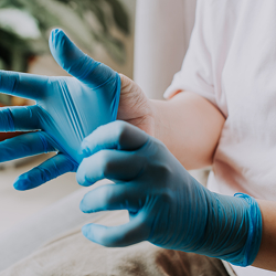 Person with Medical Gloves on