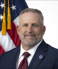 Portrait of Sean Kaufman with American Flag