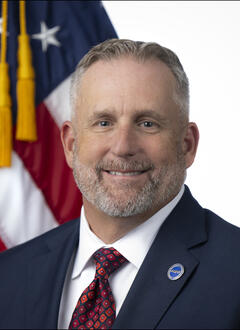 Portrait of Sean Kaufman with American Flag