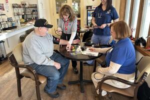 MRC taking blood pressure on a patient